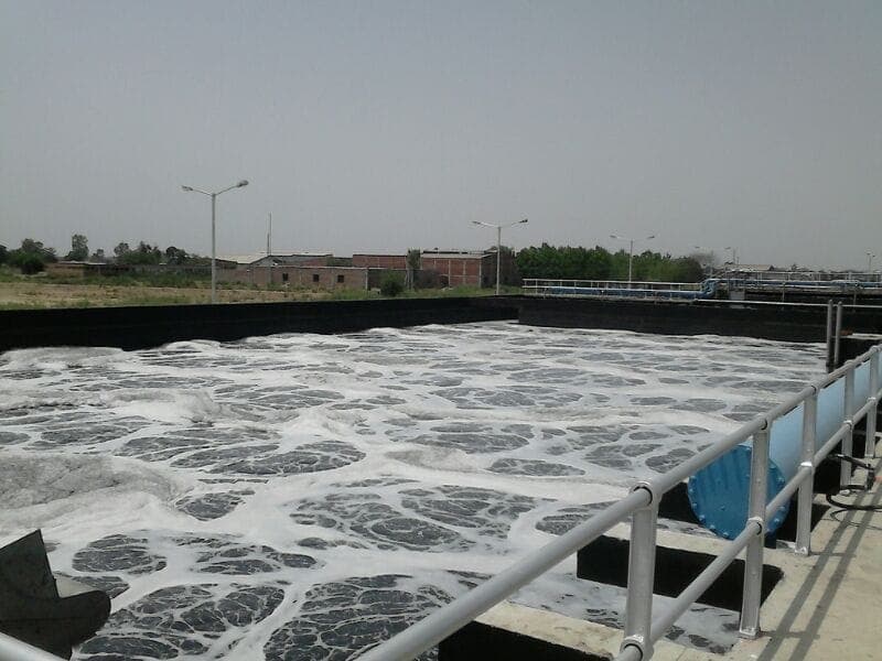 Aeration tank in operation with active diffused-air turbulence across the surface at the 50 MLD Jalandhar STP, Punjab