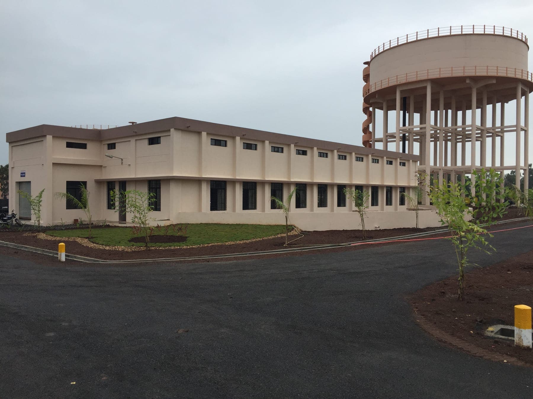 Administration and blower building alongside the elevated water storage tank at the Tapovan STP campus, Nashik